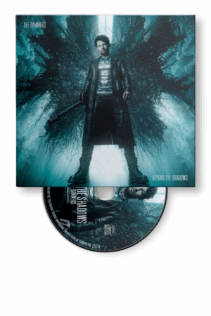 Dee Dammers in a dramatic pose amidst a shadowy forest for the "Beyond the Shadows" Digipak artwork.