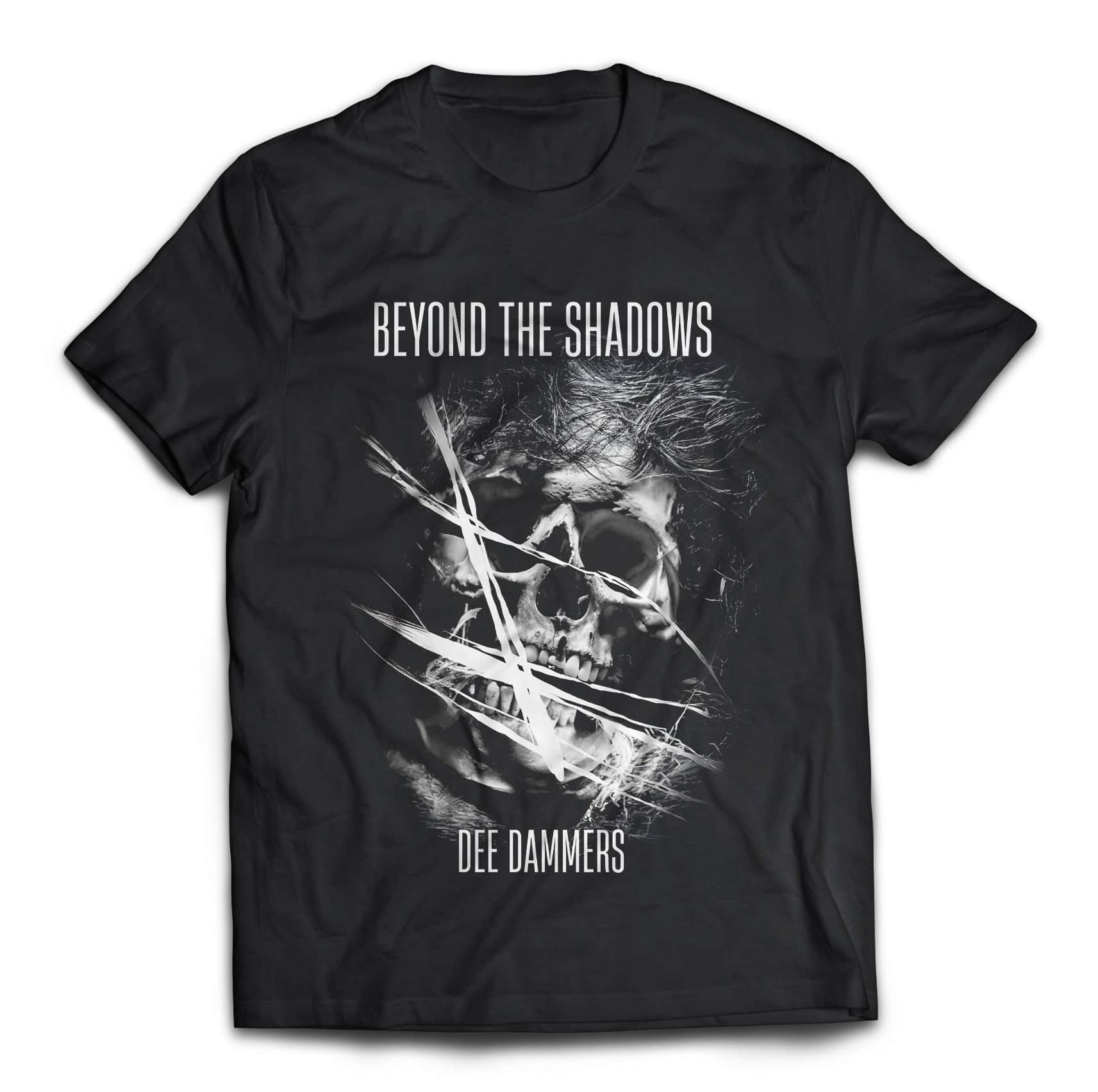 Skull graphic T-shirt with "Beyond the Shadows" text by Dee Dammers.